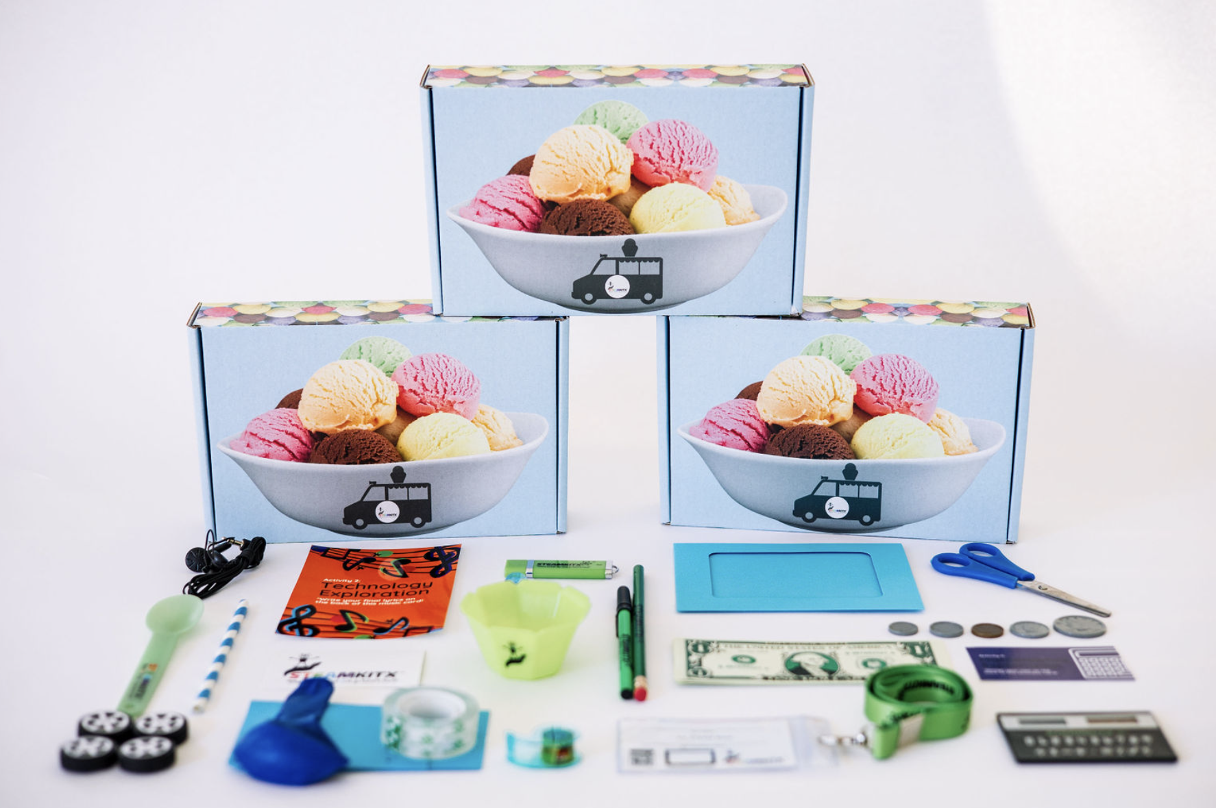 Three Ice STEAM Boss boxes with contents laid out